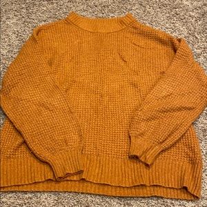 Orange cable knit sweater